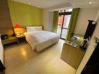 Ramada Encore By Wyndham Hualien客房内的一张或多张床位