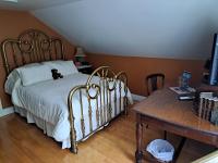 Gîte au Charme Victorien客房内的一张或多张床位