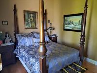 Gîte au Charme Victorien客房内的一张或多张床位