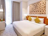 Grand Mercure Dubai City客房内的一张或多张床位