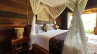 Jagadhita Villas Ubud Bali客房内的一张或多张床位