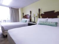 Ohia Waikiki Studio Suites客房内的一张或多张床位