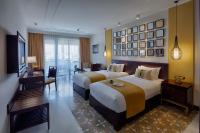Allegro Hoi An . A Little Luxury Hotel & Spa客房内的一张或多张床位