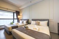 Mossaz Suites by MyKey客房内的一张或多张床位