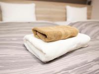 Hotel Route Inn Suzaka客房内的一张或多张床位