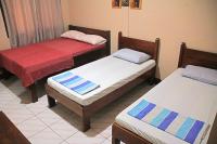 JBR Tourist Inn II - Port Barton客房内的一张或多张床位