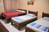 JBR Tourist Inn II - Port Barton客房内的一张或多张床位