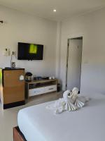 The Lodge at Koh Kood客房内的一张或多张床位