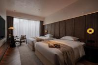 Rong Unique Hotel-Banyan Lake Scenery客房内的一张或多张床位