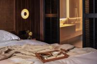Rong Unique Hotel-Banyan Lake Scenery客房内的一张或多张床位