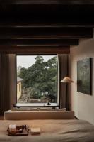 Rong Unique Hotel-Banyan Lake Scenery客房内的一张或多张床位