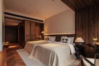 Rong Unique Hotel-Banyan Lake Scenery客房内的一张或多张床位
