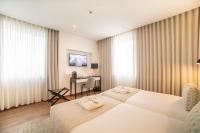 VIP Executive Picoas Hotel客房内的一张或多张床位