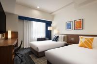Four Points Flex by Sheraton Nagoya Station客房内的一张或多张床位
