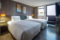 Ramada Encore By Wyndham Hualien客房内的一张或多张床位