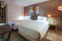 Ramada Encore By Wyndham Hualien客房内的一张或多张床位