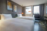 Ramada Encore By Wyndham Hualien客房内的一张或多张床位