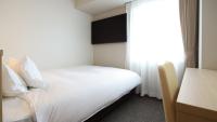 AB Hotel Shiojiri客房内的一张或多张床位