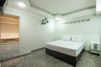 Hotel Age - Próximo Arena Corinthians e Aeroporto de Guarulhos客房内的一张或多张床位