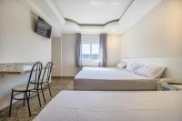 Hotel Age - Próximo Arena Corinthians e Aeroporto de Guarulhos客房内的一张或多张床位