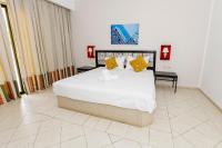 Le Petit Palais Djerba & Spa客房内的一张或多张床位