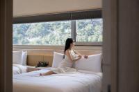 Mer de laube Hotel客房内的一张或多张床位