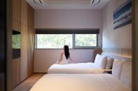 Mer de laube Hotel客房内的一张或多张床位