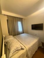 Flat Estaza Luxo Moema Ibirapuera com garagem piscina 202客房内的一张或多张床位