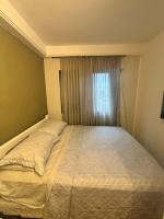 Flat Estaza Luxo Moema Ibirapuera com garagem piscina 202客房内的一张或多张床位