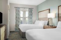 Sheraton Broadway Resort Villas客房内的一张或多张床位