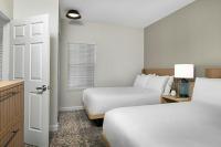 Sheraton Broadway Resort Villas客房内的一张或多张床位