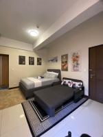 A&G Condotel at 101newport Across NAIA T3客房内的一张或多张床位