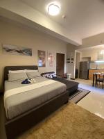 A&G Condotel at 101newport Across NAIA T3客房内的一张或多张床位