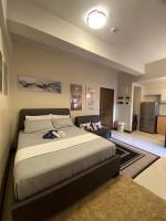 A&G Condotel at 101newport Across NAIA T3客房内的一张或多张床位