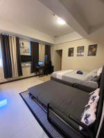 A&G Condotel at 101newport Across NAIA T3客房内的一张或多张床位