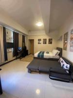 A&G Condotel at 101newport Across NAIA T3客房内的一张或多张床位