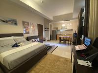 A&G Condotel at 101newport Across NAIA T3客房内的一张或多张床位