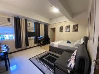 A&G Condotel at 101newport Across NAIA T3客房内的一张或多张床位