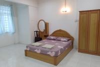 Welcome to Gemas Homestay ALI客房内的一张或多张床位
