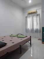 Welcome to Gemas Homestay ALI客房内的一张或多张床位