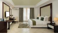 Peninsula Hotel Dar Es Salaam客房内的一张或多张床位
