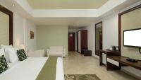 Peninsula Hotel Dar Es Salaam的电视和/或娱乐中心