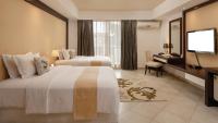 Peninsula Hotel Dar Es Salaam客房内的一张或多张床位