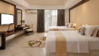 Peninsula Hotel Dar Es Salaam客房内的一张或多张床位