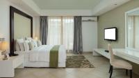 Peninsula Hotel Dar Es Salaam客房内的一张或多张床位