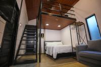 Casa Damai Janda Baik - RIVERVIEW TINY HOUSE客房内的一张或多张床位