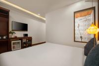 RAON Old Quarter Hotel客房内的一张或多张床位