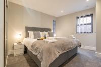Bond House by Celador Apartments客房内的一张或多张床位