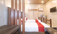 RedDoorz at MBB Room NAIA 2客房内的一张或多张床位