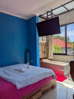 Ceria House Ungasan Uluwatu客房内的一张或多张床位